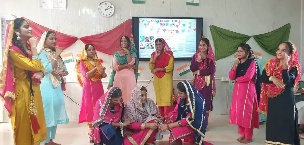 Students performing Dogri folk dance during Dogra festival celebration